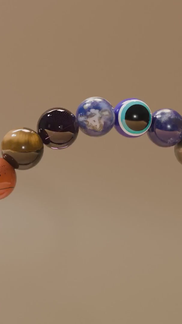 Close-up video of ZARAGRACE chakra healing bracelet rotating under soft lighting, showcasing colorful beads, Evil Eye charm, and Gloss Onyx for spiritual energy and manifestation.